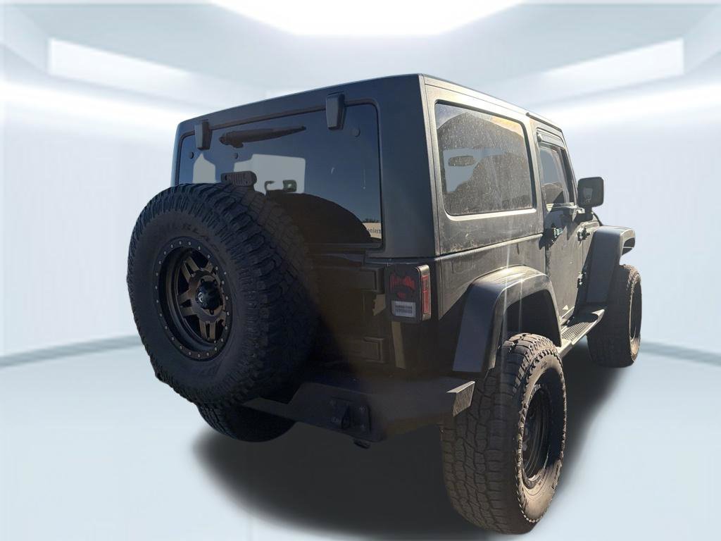 Used 2015 Black Clearcoat Jeep Sahara image 11