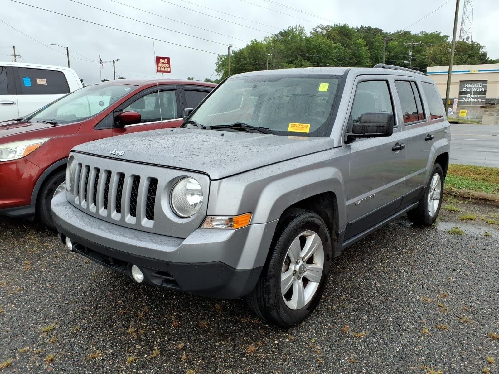Used 2016 Deep Cherry Red Crystal Pearlcoat Jeep Sport image 1