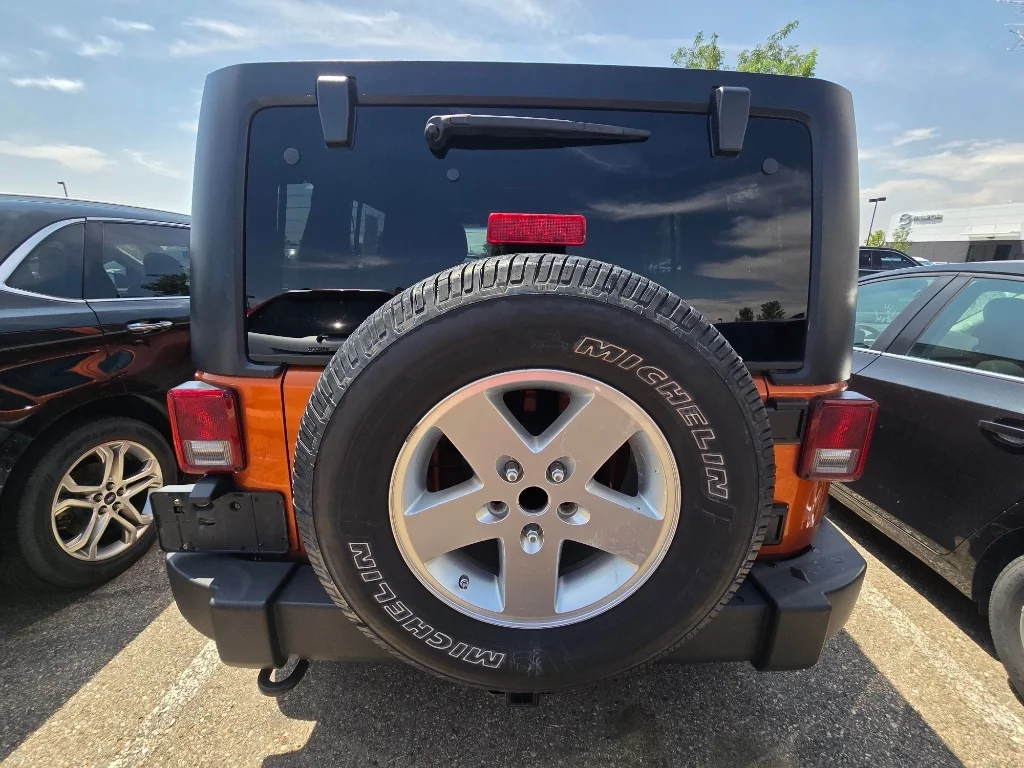 Used 2011 Mango Tango Pearlcoat Jeep Sport image 4