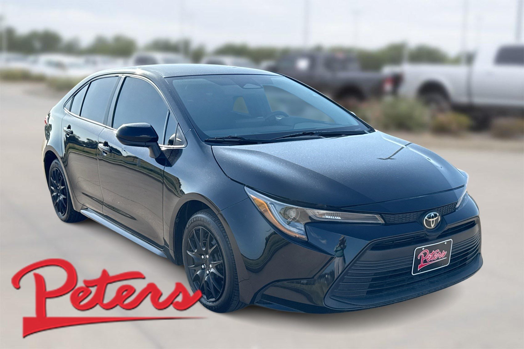 Used 2024 Midnight Black Metallic Toyota LE image 1