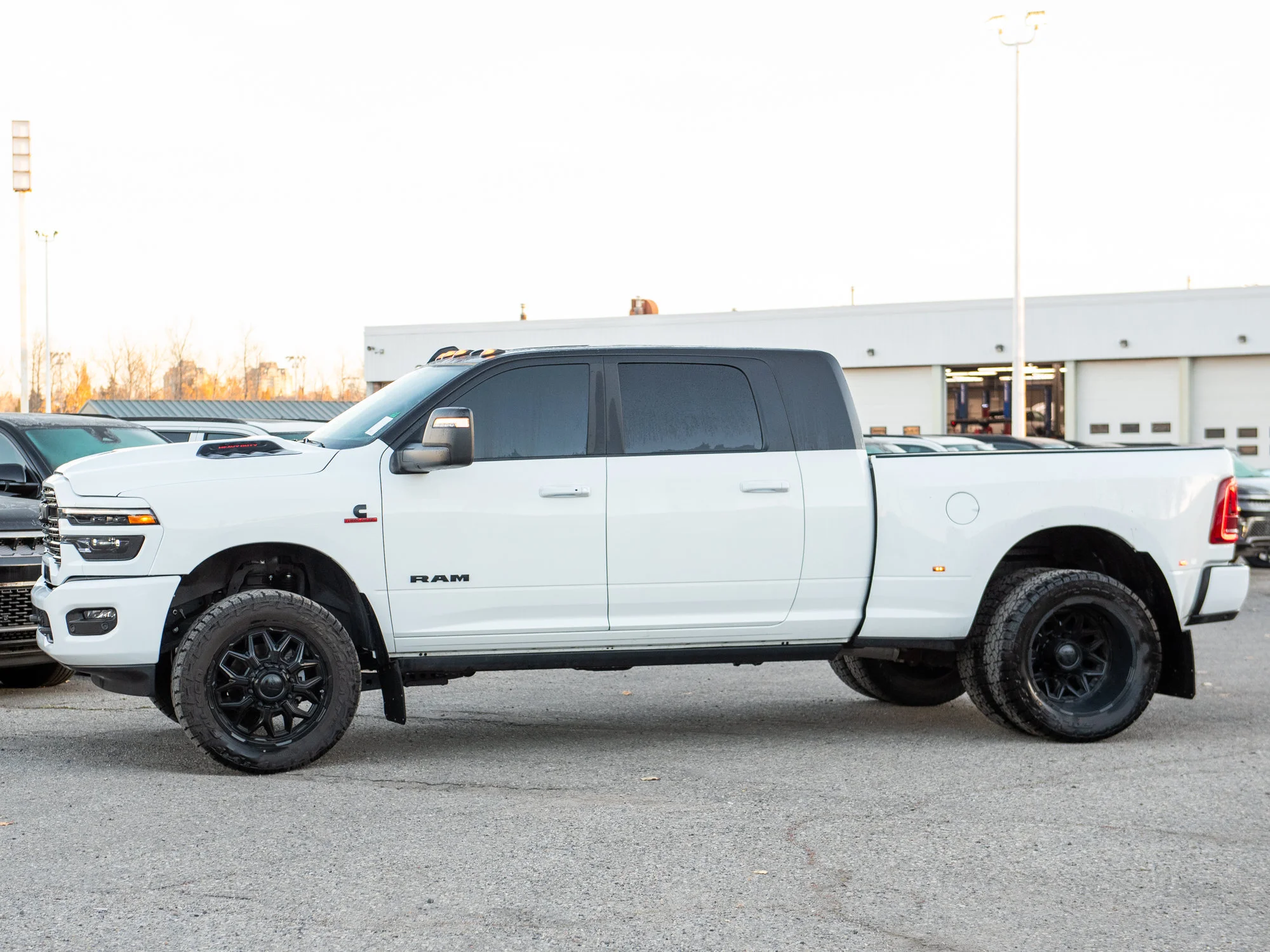 Used 2026 White RAM Laramie* Mega Cab 4x4, 2 Inch Lift, 35 Inch Tires image 3