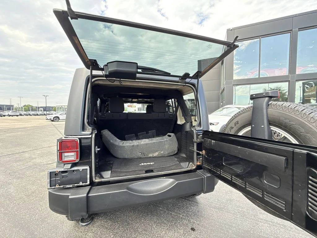 Used 2013 Black Jeep Unlimited Sport image 24