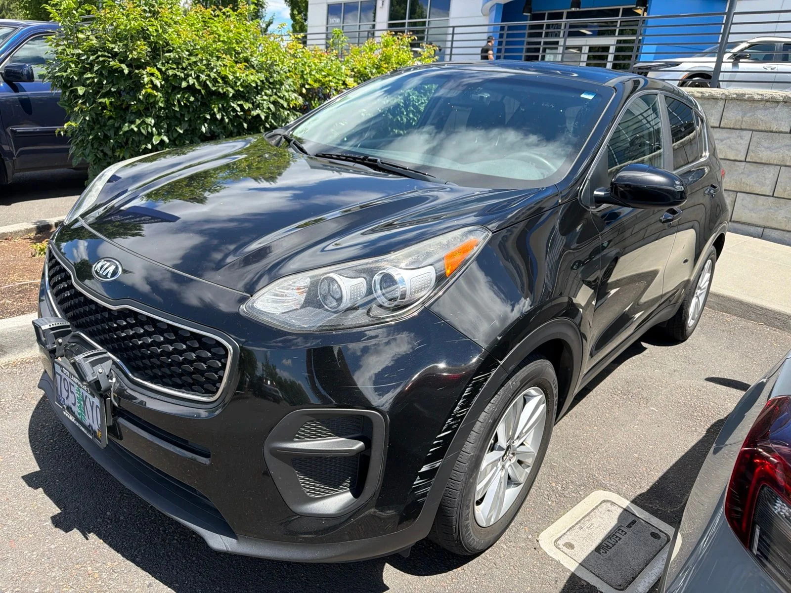 Used 2018 Black Cherry Kia LX image 1