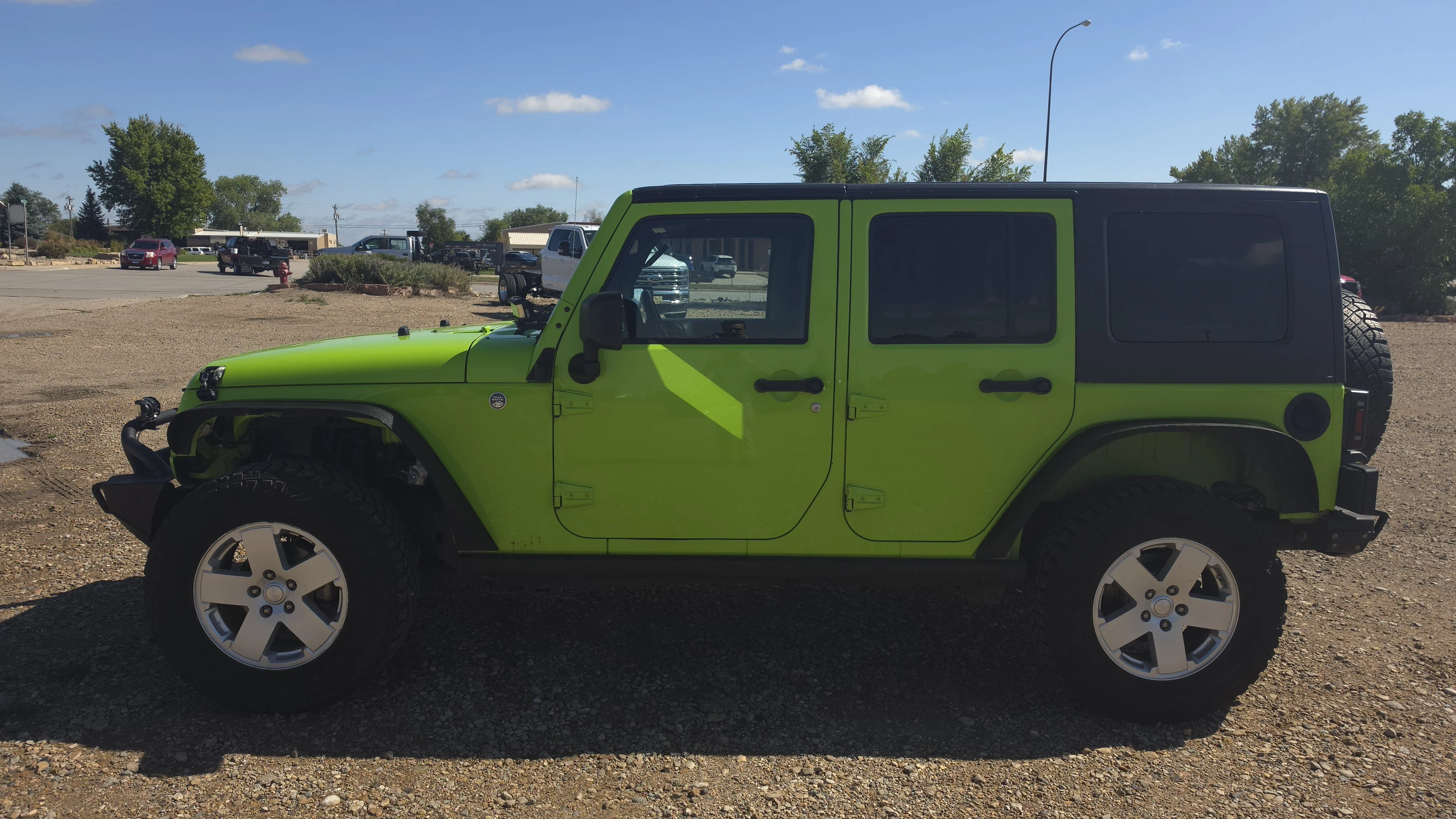 Used 2012 Jeep Wrangler Unlimited Sahara with VIN 1C4BJWEG8CL225428 for sale in Belle Fourche, SD
