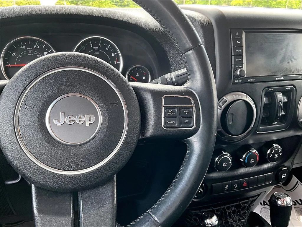 Used 2015 Red Jeep Unlimited Sport image 17