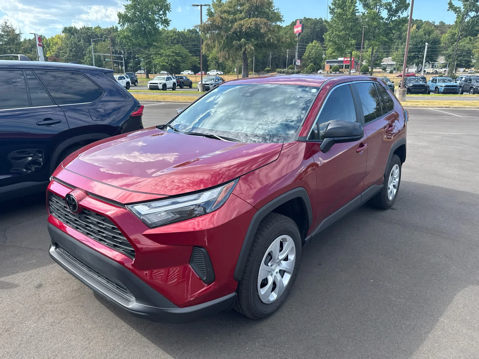 Certified Used 2025 Ruby Flare Pearl Toyota LE image 2