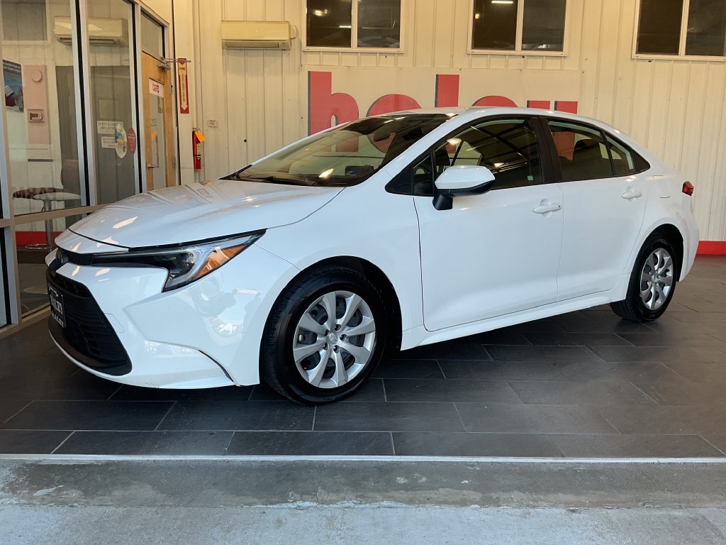 Used 2025 White Toyota LE image 1