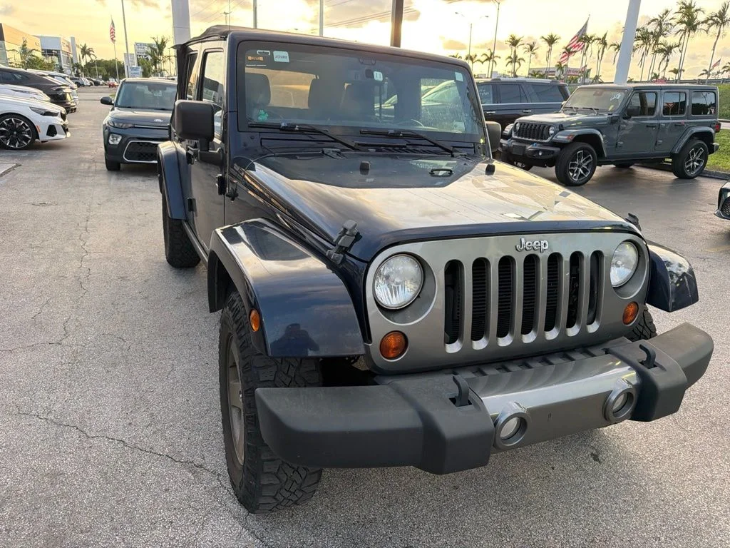 Used 2013 True Blue Pearlcoat Jeep Unlimited Freedom Edition image 1