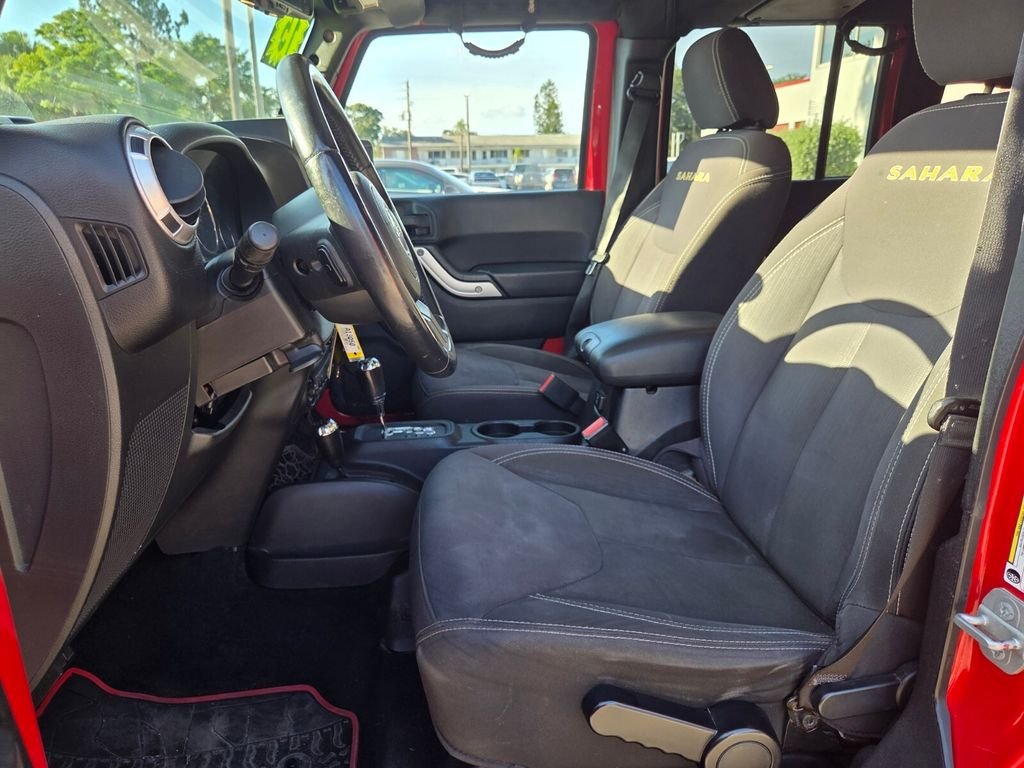 Used 2015 Red Jeep Unlimited Sahara image 11