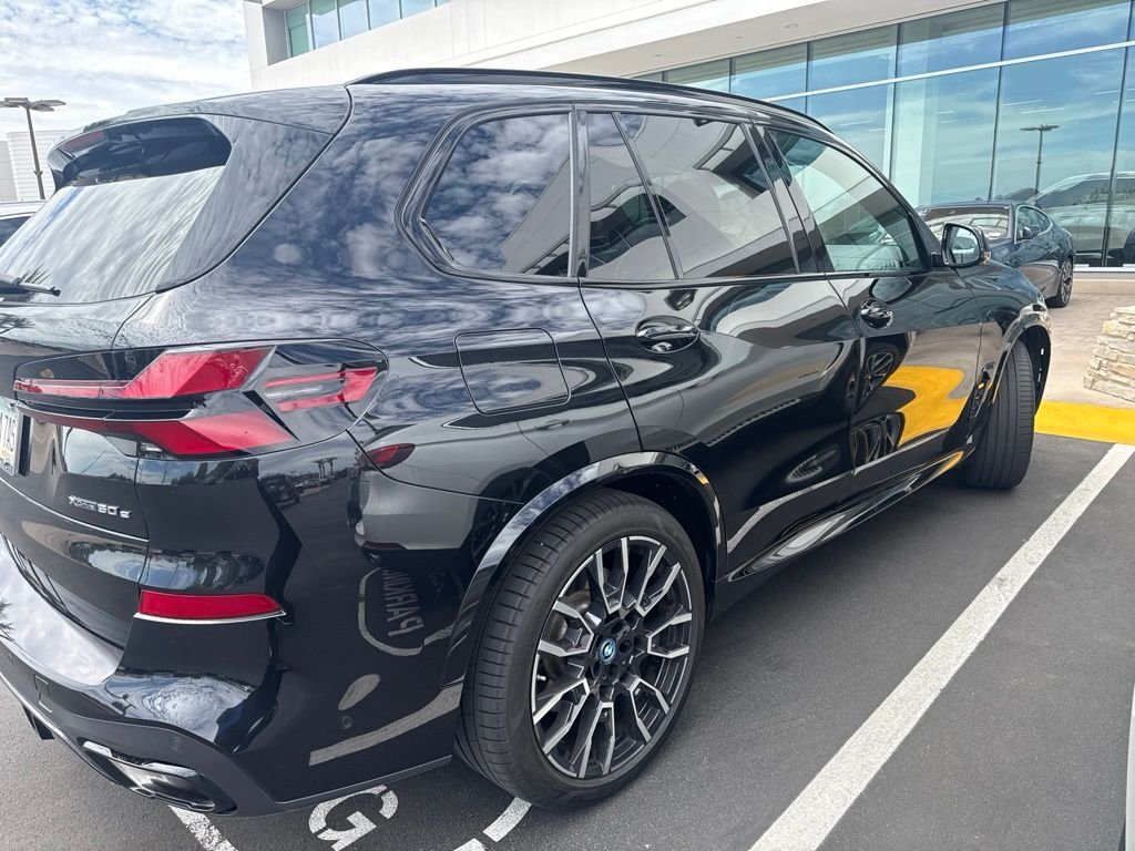 Certified Used 2024 Black Sapphire Metallic BMW xDrive50e image 5