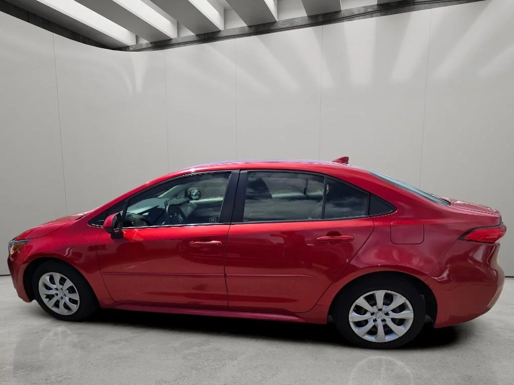 Used 2021 Barcelona Red Metallic Toyota LE image 4