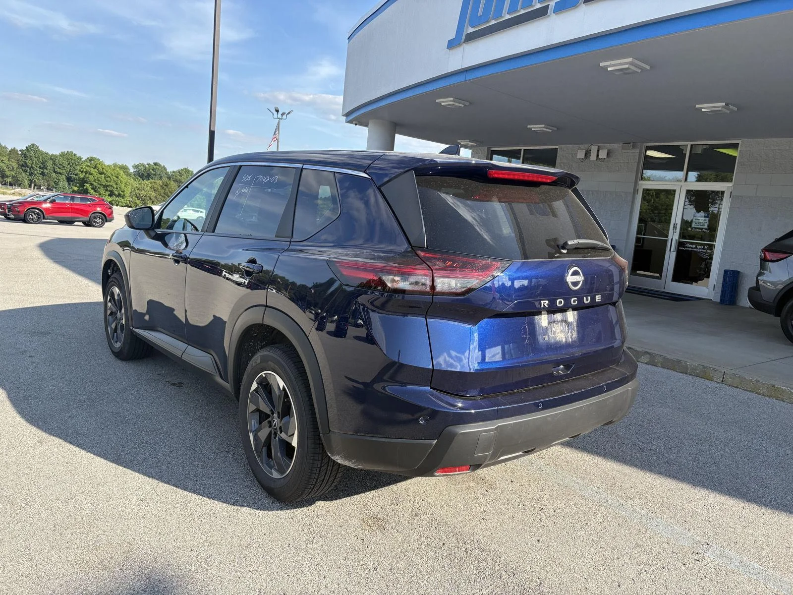 Used 2025 Deep Ocean Blue Pearl Nissan SV image 3