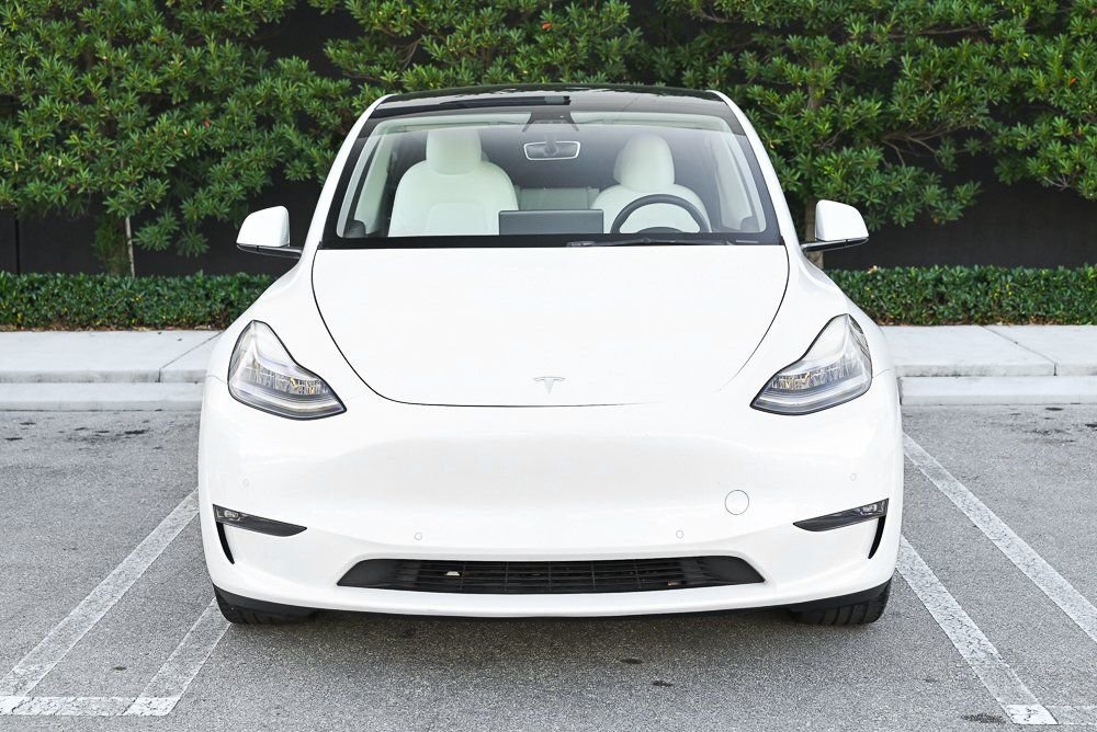 Used 2021 Tesla Model Y Standard Range with VIN 5YJYGDED6MF103058 for sale in Miami, FL