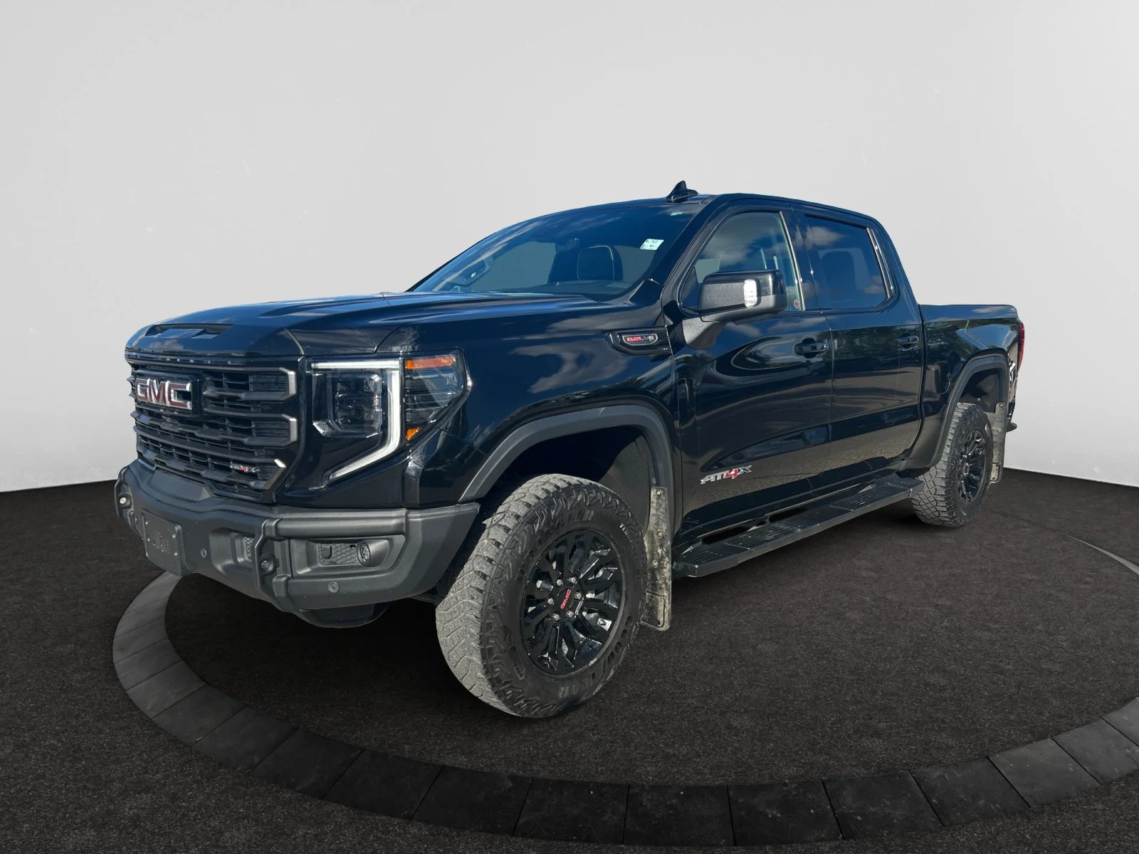 Used 2023 Black GMC AT4X Crew Cab image 1