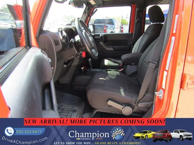 Used 2015 Orange Jeep Unlimited Sport image 11