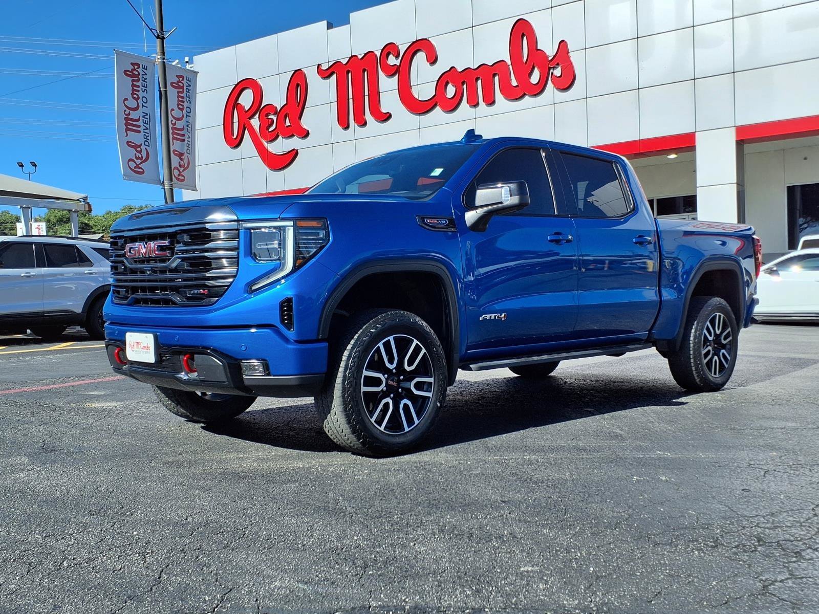 Used 2024 Dynamic Blue Metallic GMC AT4 image 1