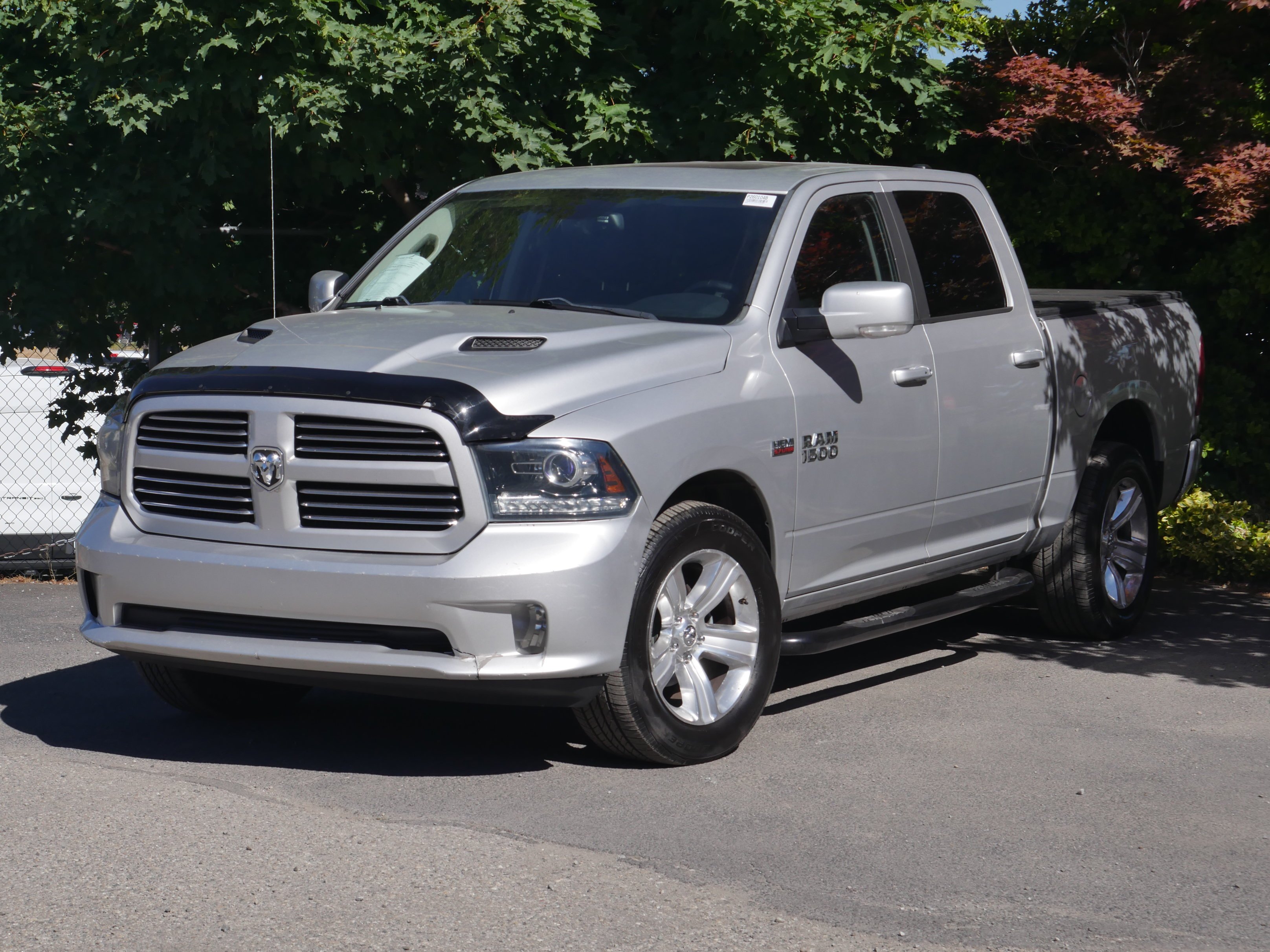 Used 2013 Bright Silver Clearcoat Metallic Ram Sport image 2
