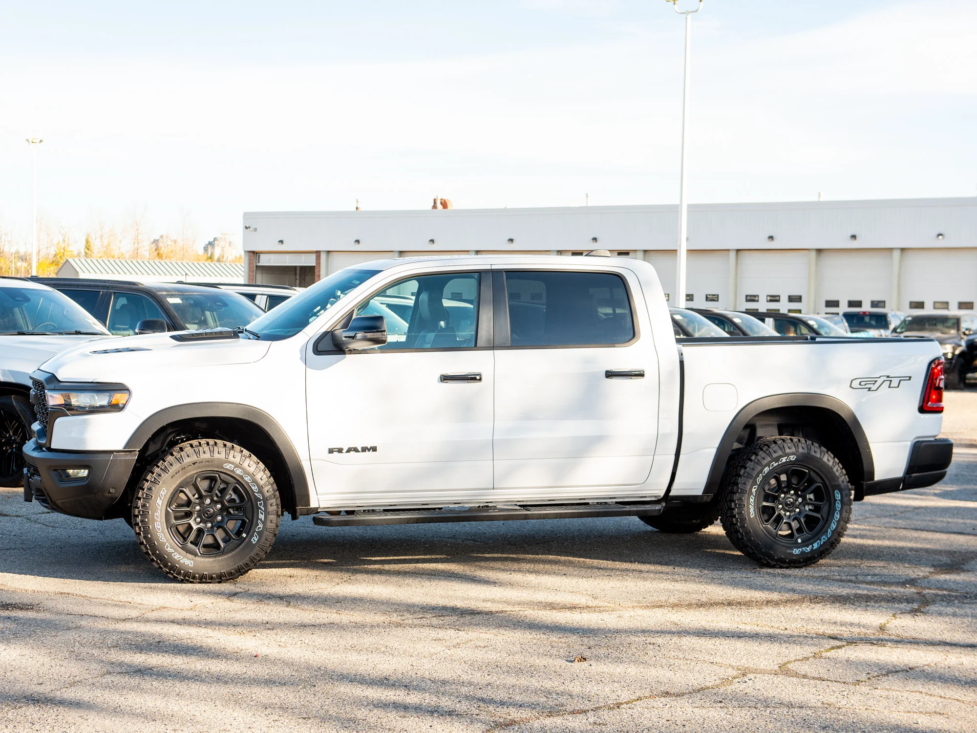New 2026 White RAM Rebel G/T* Crew Cab 4x4, Pano Sunroof, Passive Cold End Exhaust, Passenger Screen image 3