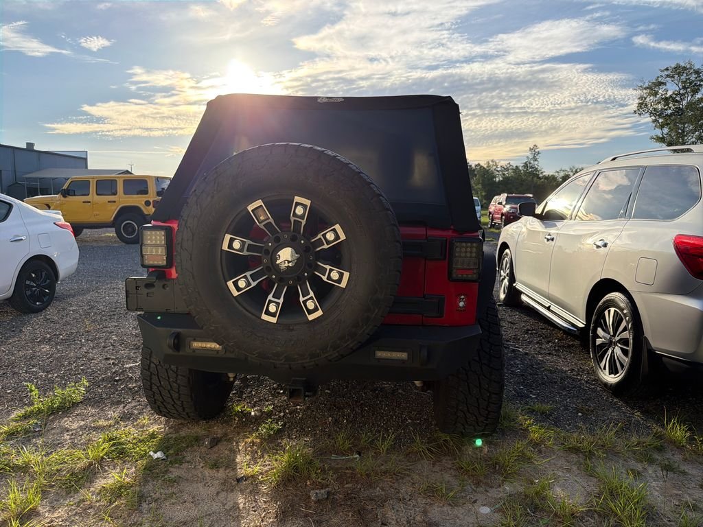 Used 2015 Red Jeep Unlimited Sport image 6