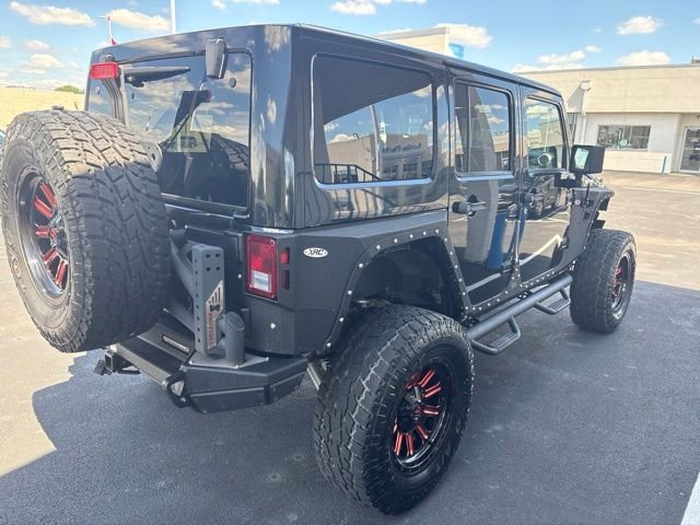 Used 2013 Black Jeep Unlimited Sahara image 8