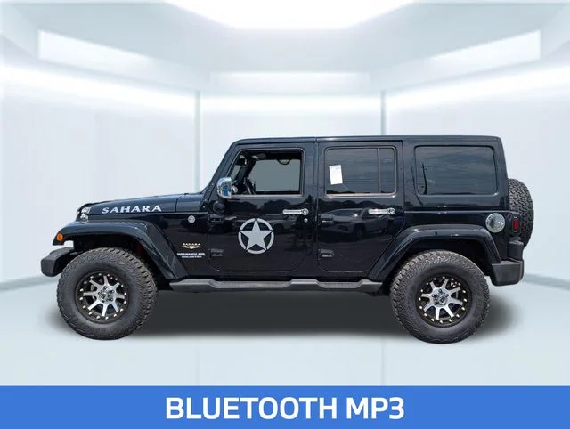 Used 2013 Black Jeep Unlimited Sahara image 2