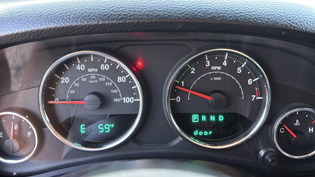 Used 2013 Billet Clearcoat Metallic Jeep Unlimited Sport image 10