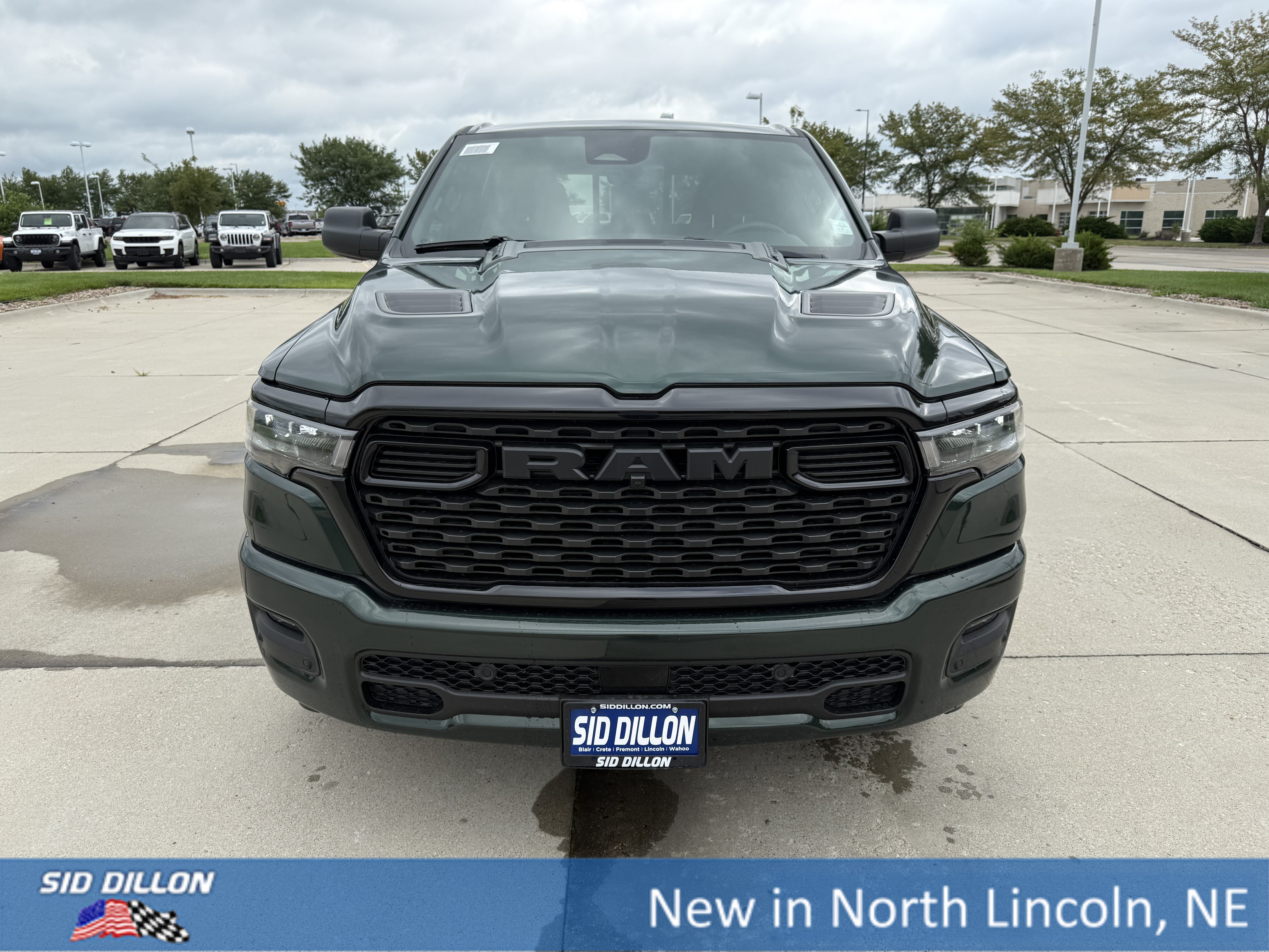 New 2026 Serrano-Green Metallic Exterior Paint RAM 4WD CREW 5