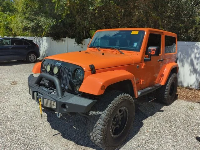 Used 2012 Orange Jeep Sahara image 3