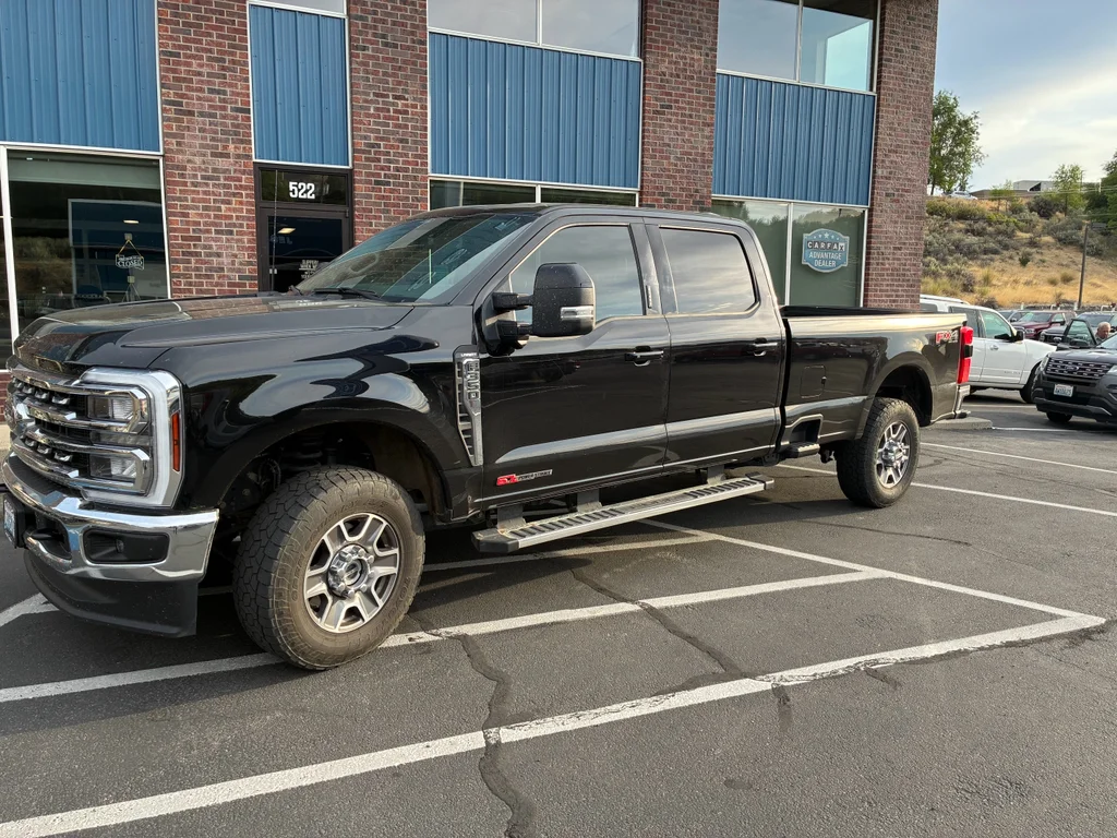 Used 2024 Agate Black Metallic Ford LARIAT image 1