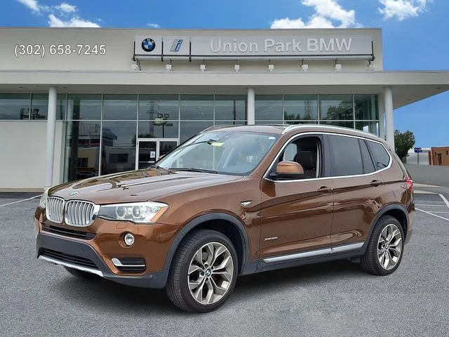 Used 2017 Chestnut Bronze Metallic BMW xDrive28i image 1