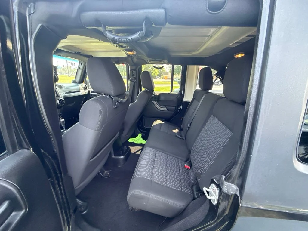 Used 2012 Black Jeep Unlimited Sport image 13
