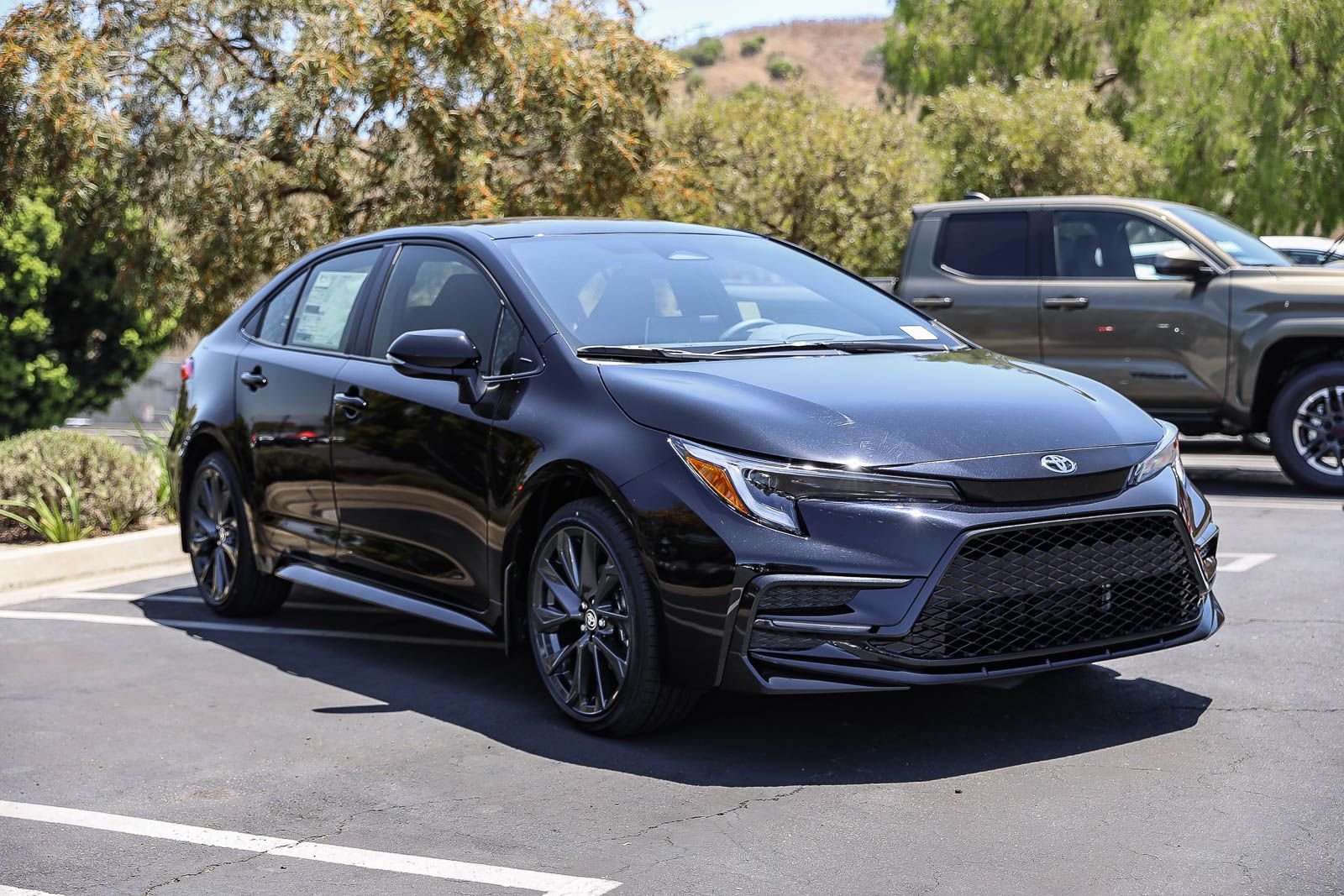 New 2026 Midnight Black Metallic Toyota  SE image 3