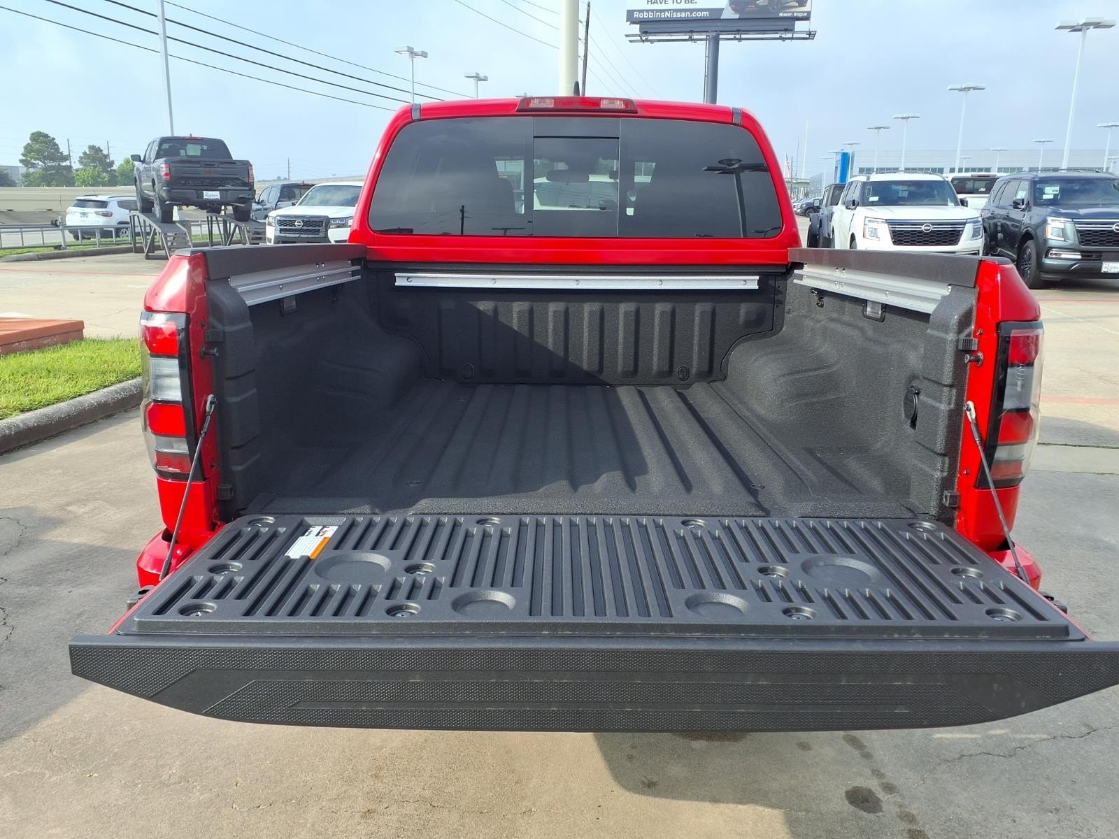 2026 Nissan Frontier SV Red at Robbins Nissan