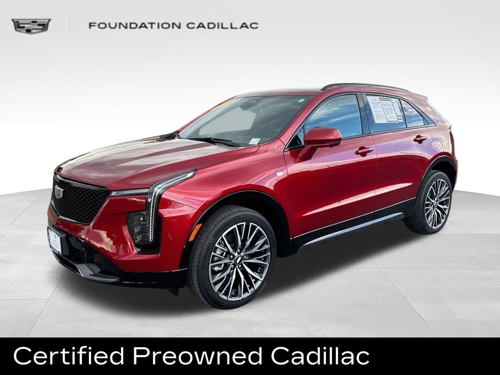Used 2025 Radiant Red Tintcoat Cadillac Sport image 1