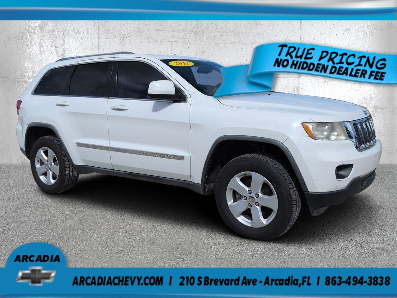 Used 2012 Stone White Jeep Laredo image 1