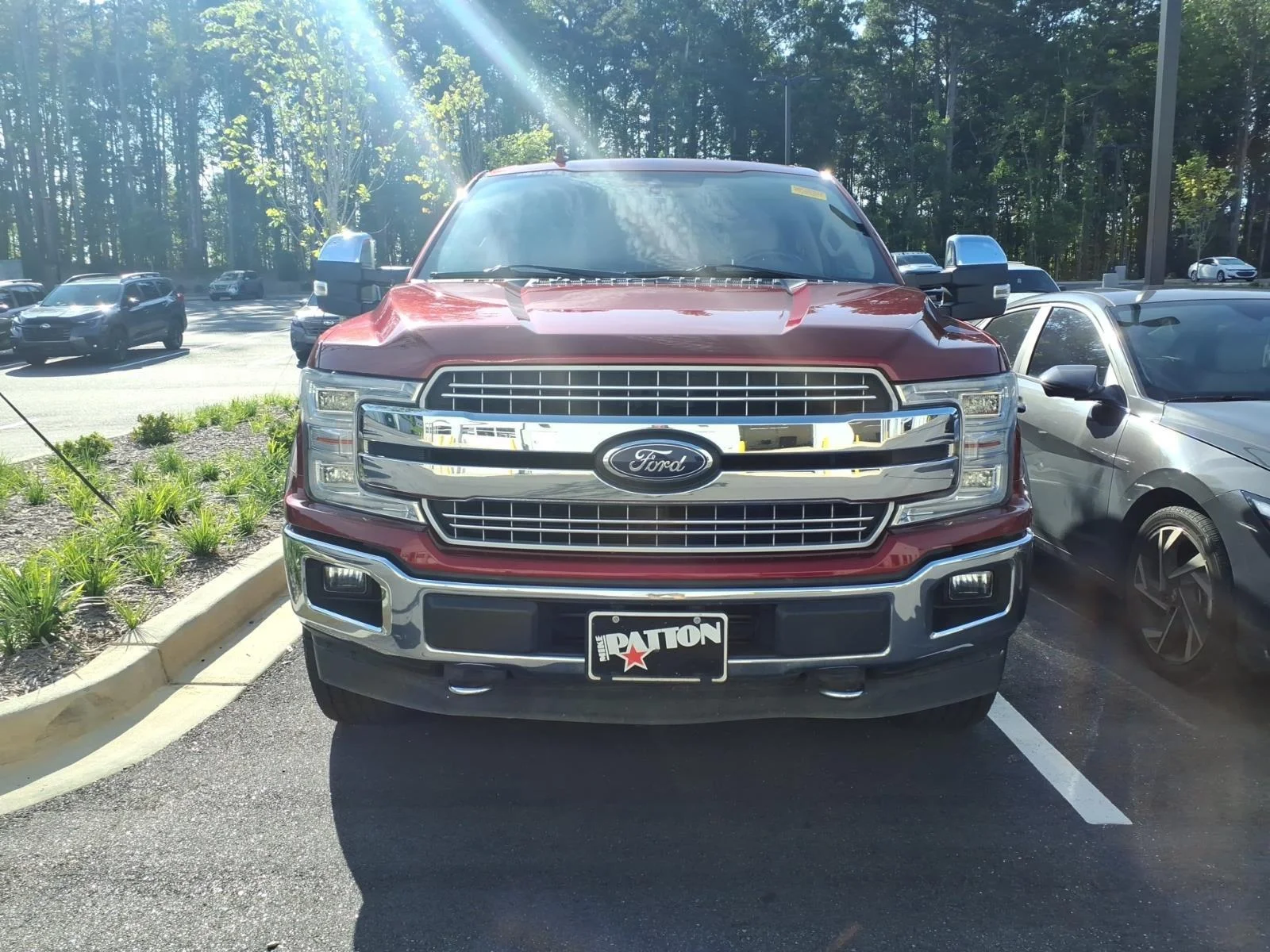 Used 2018 Ruby Red Metallic Tinted Clearcoat/Stone Gray Ford LARIAT image 1