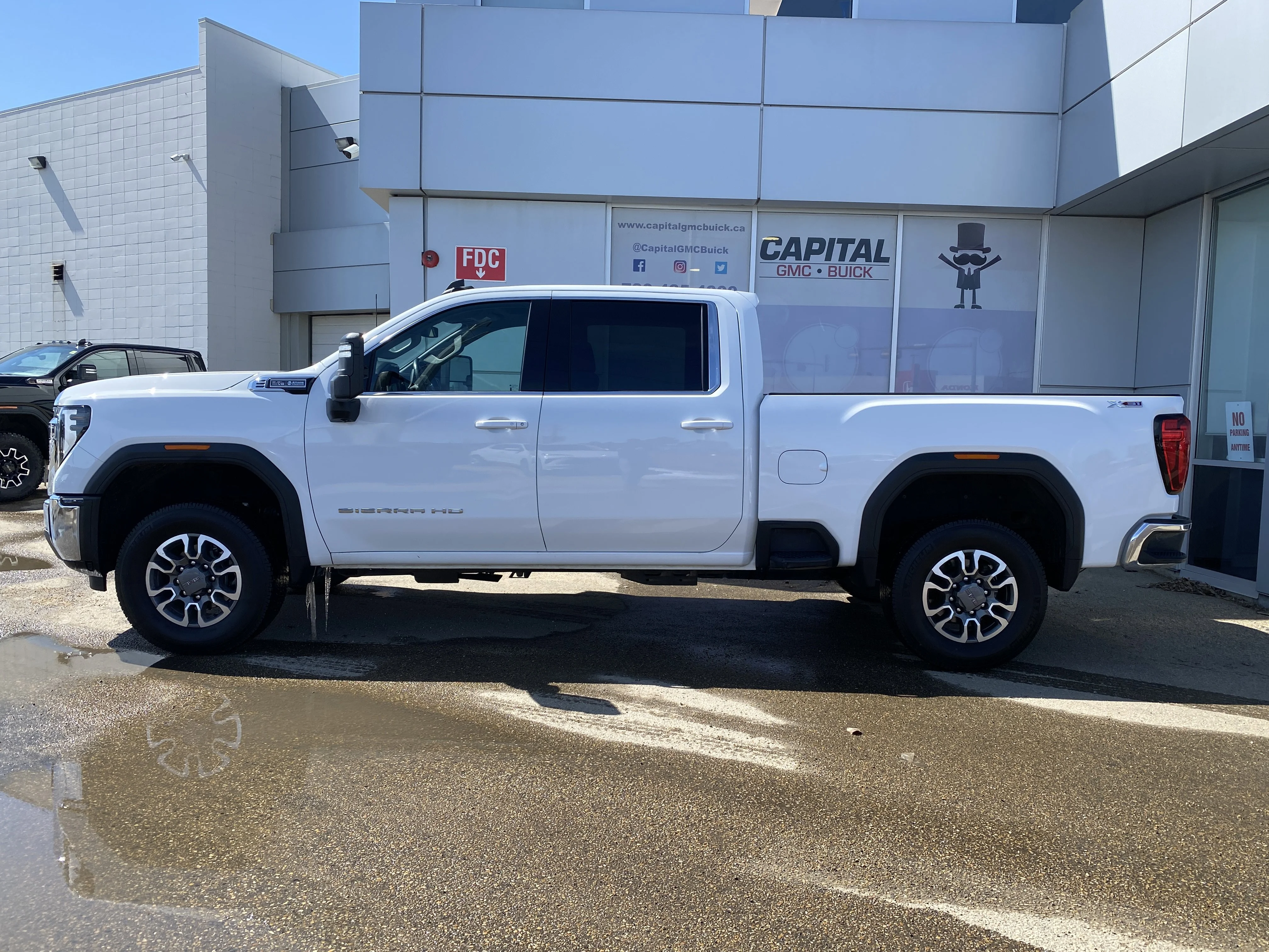 Used 2024 White GMC Crew Cab SLE image 2