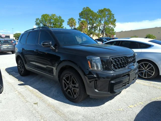 Used 2025 Black Kia EX X-Line image 1