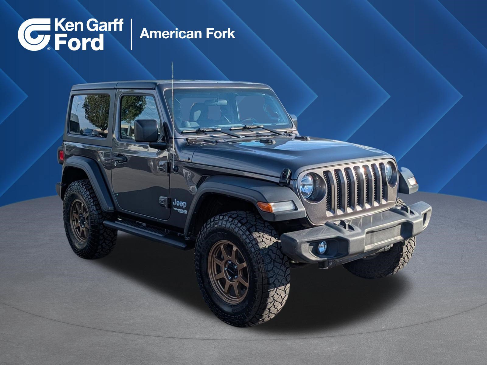 Used 2018 Granite Crystal Clearcoat Metallic Jeep Sport S image 1