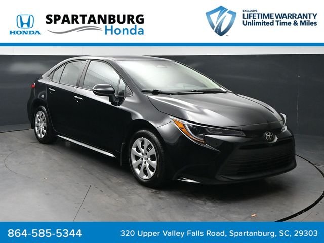 Used 2025 Midnight Black Metallic Toyota LE image 1