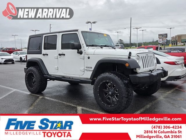 Used 2016 White Jeep Unlimited Sport image 1