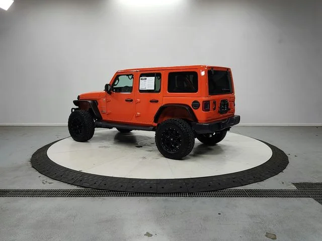 Used 2018 Orange Jeep Unlimited Sahara image 5