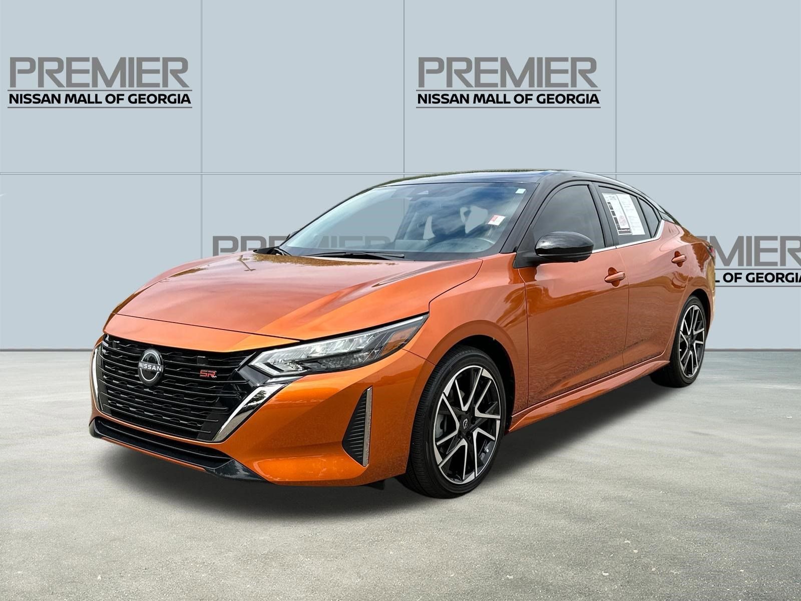 Certified Used 2025 Orange Nissan SR image 1