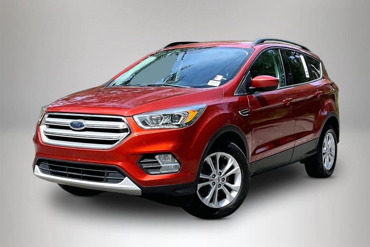 Used 2019 Orange Ford SEL image 1