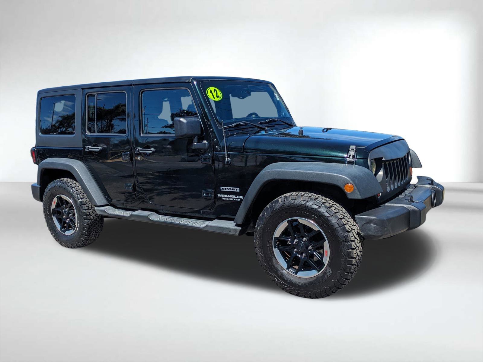 Used 2012 Jeep Wrangler Unlimited Sport with VIN 1C4BJWDG7CL203518 for sale in Seminole, FL