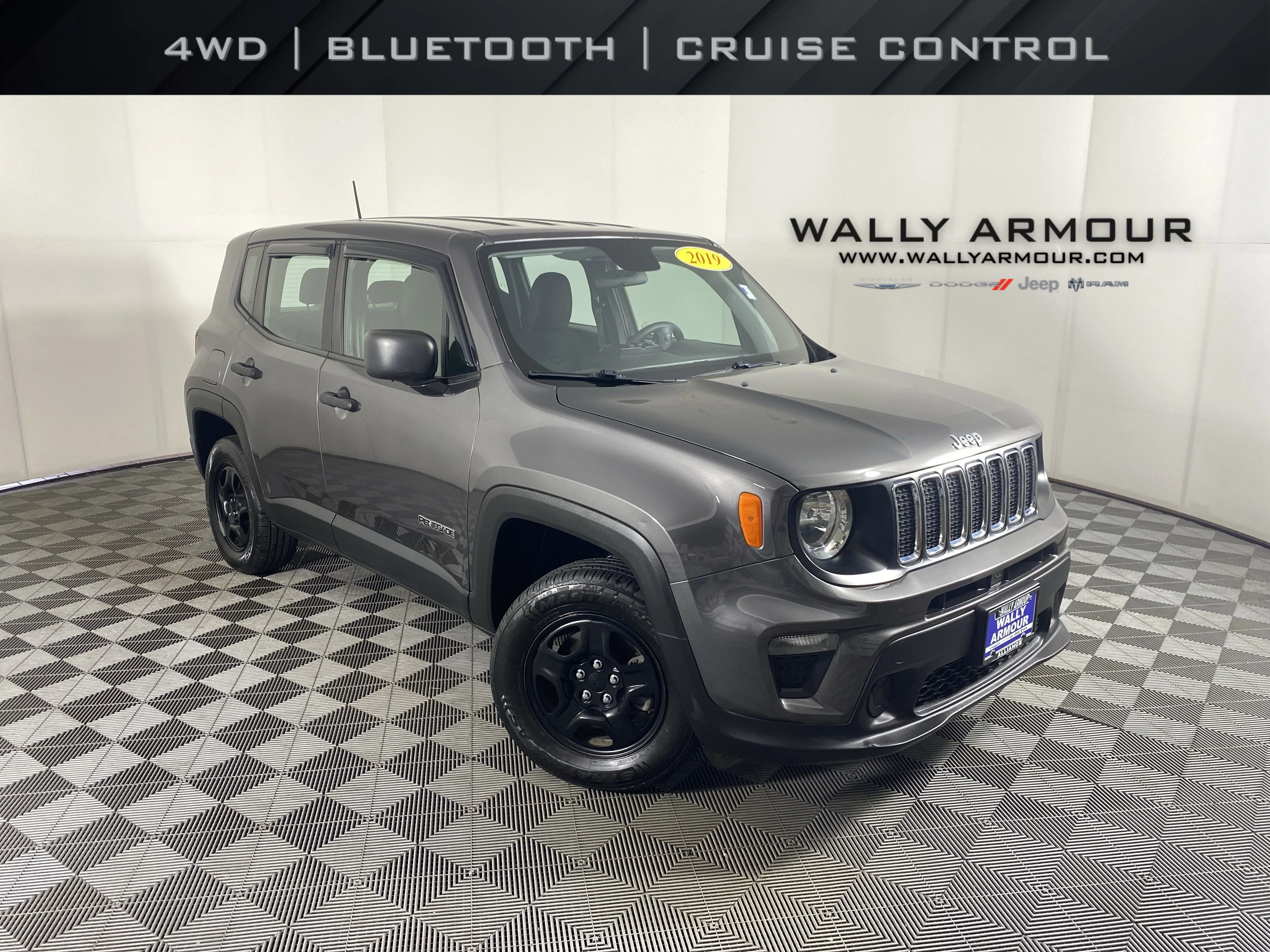 Used 2019 Granite Crystal Metallic Clearcoat Jeep Sport image 1