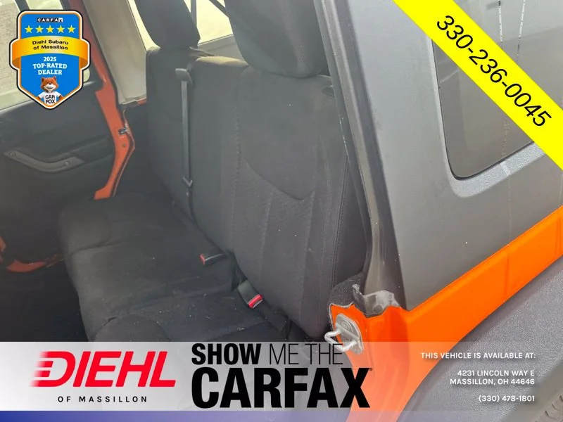 Used 2013 Orange Jeep Unlimited Sport image 11