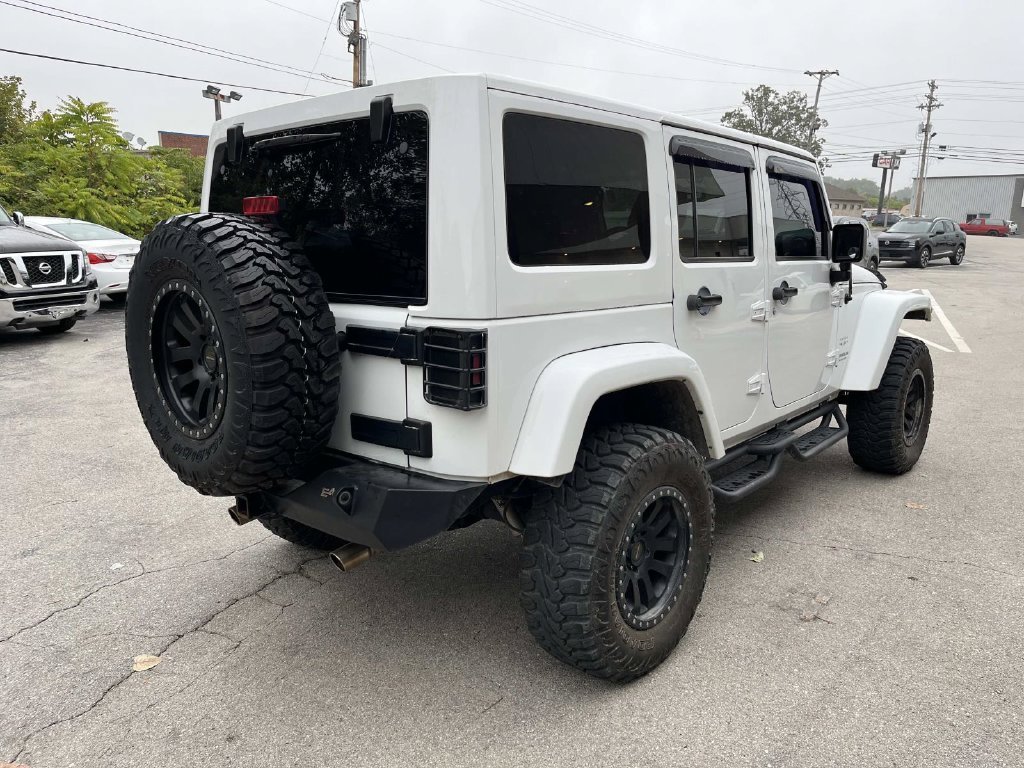 Used 2016 White Jeep Unlimited Sahara image 5
