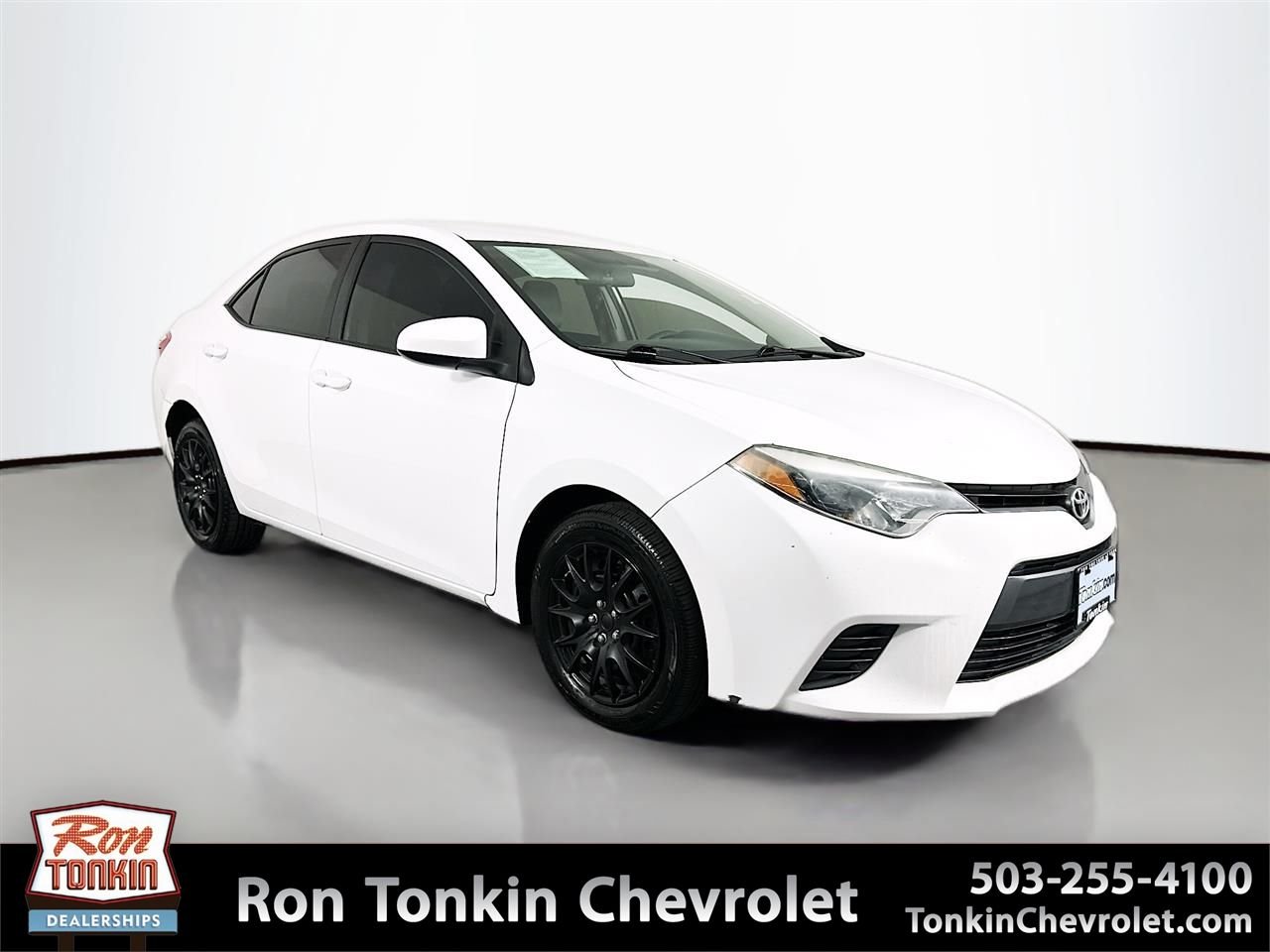Used 2015 Super White Toyota LE image 1