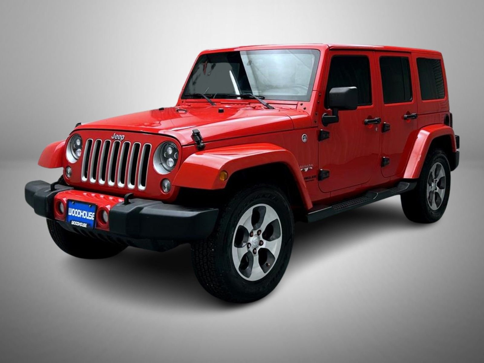 Used 2016 Red Jeep Unlimited Sahara image 1